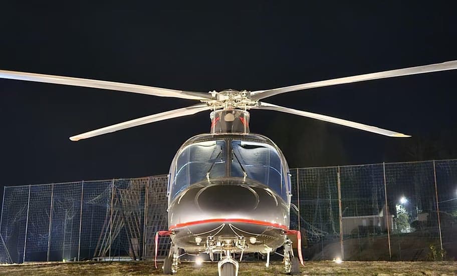 Front view of a helicopter at night.