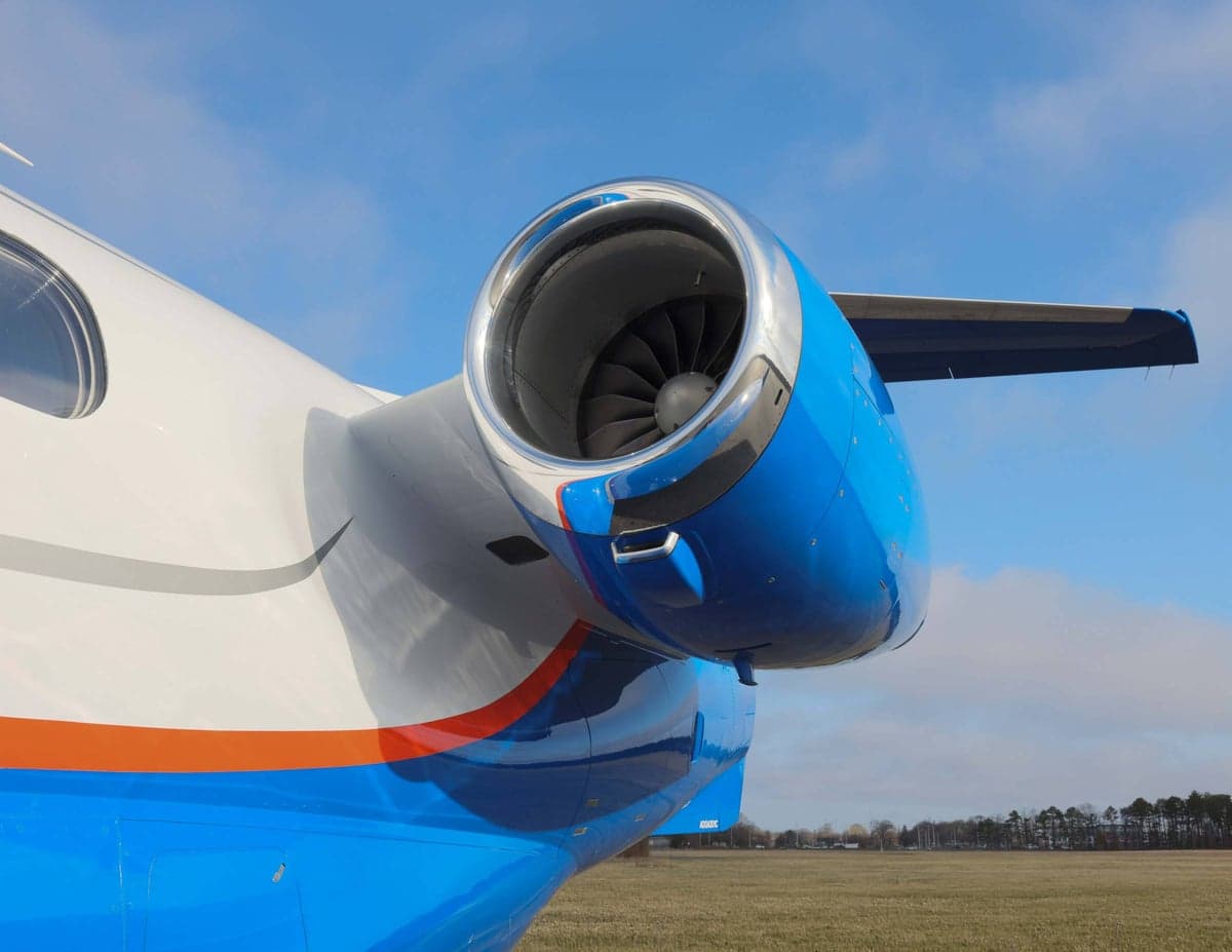 Close-up of the Phenom 300E aircraft's engine nacelle.