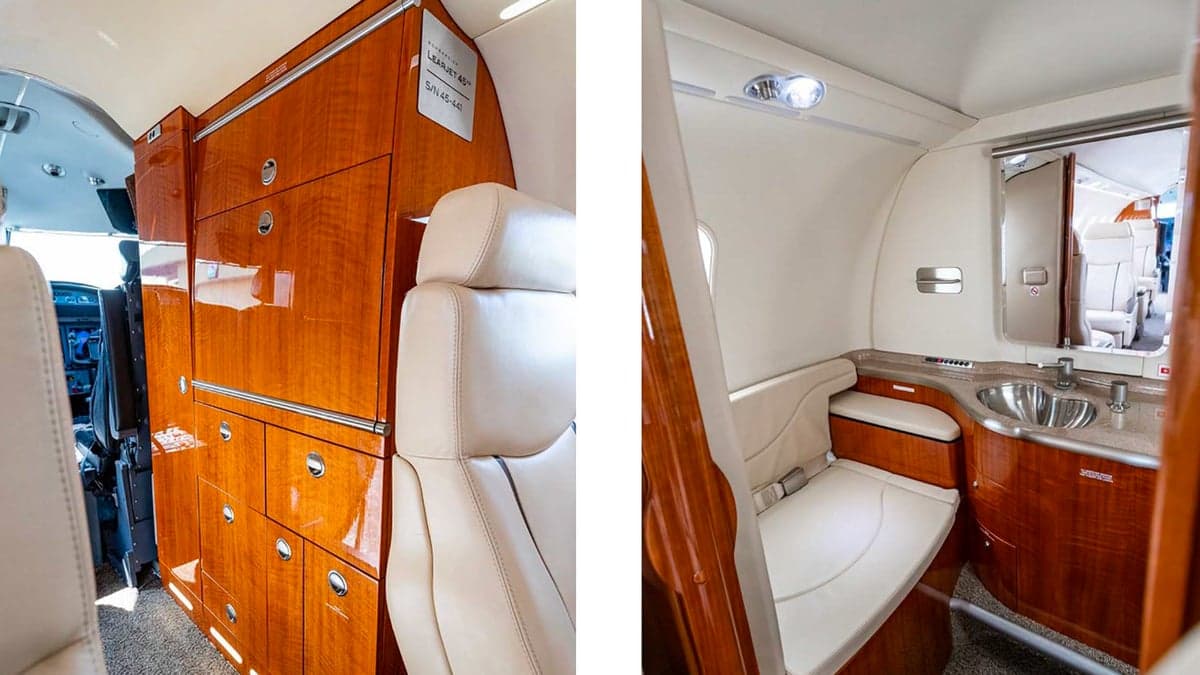 Interior view of the aircraft showing cabinetry and seating.