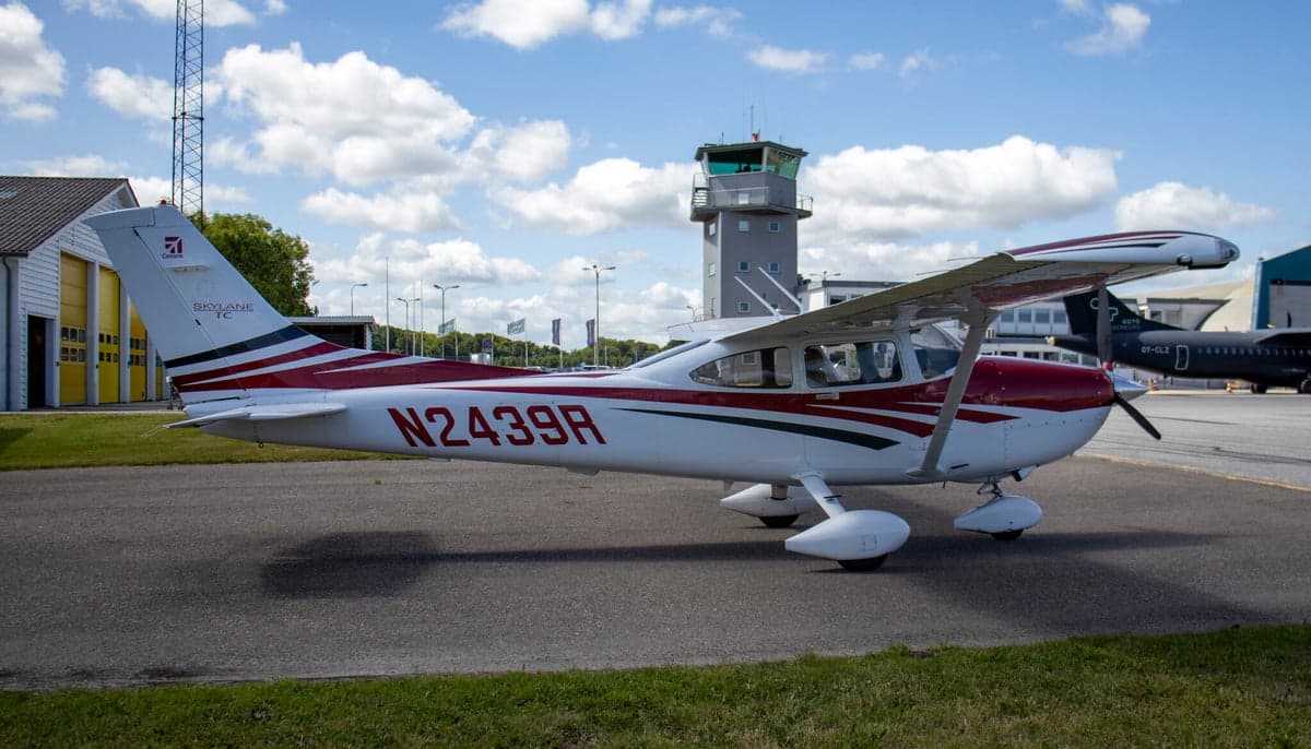 A Cessna Skylane TC, registration N2439R, parked on the tarmac with a red and white paint scheme.