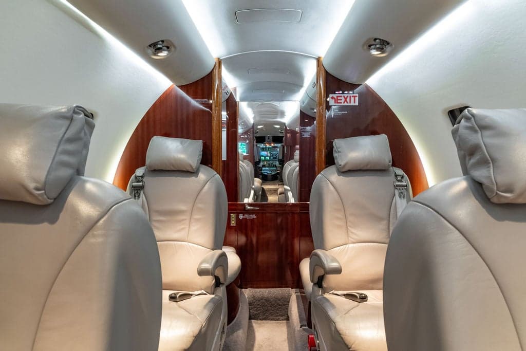 Interior of a Cessna Citation CJ3+ aircraft, showing the seating arrangement.