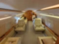 A blurry close-up of the Challenger aircraft door and stairs.
