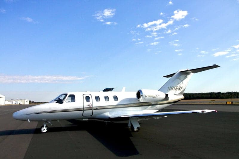 A Citation Jet with tail number N915SF sits on the tarmac.