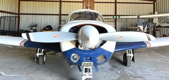 Front view of the N3388X aircraft inside a hangar.
