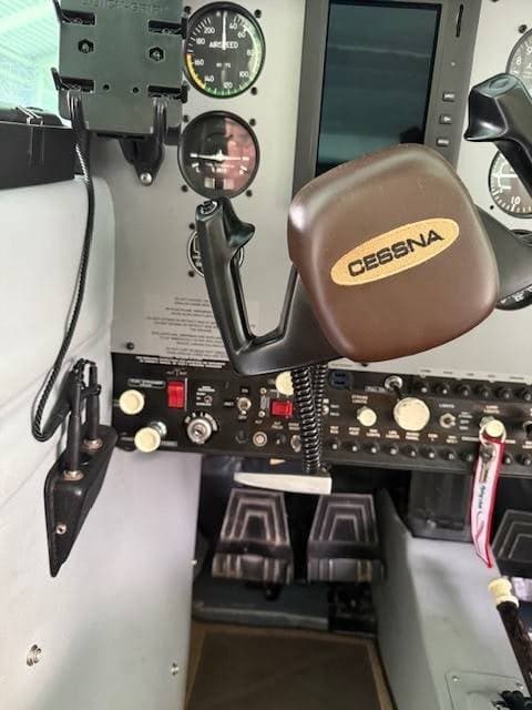 A close-up of the left pilot's yoke and instrument panel in the Cessna cockpit.