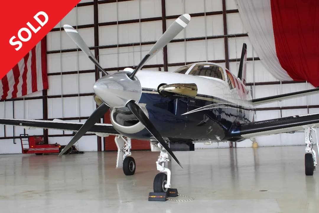 Pilatus PC-12 NG in a hangar with SOLD overlay.