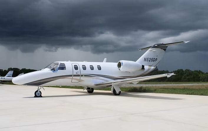 Cessna Citation CJ3 aircraft with registration N525DP parked on the tarmac.