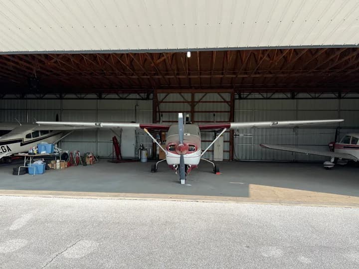 Front view of a Cessna aircraft inside a hangar.