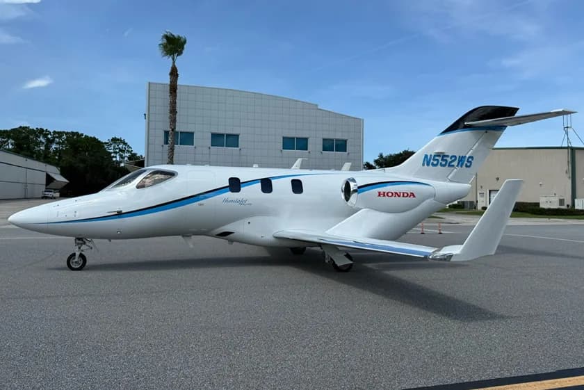 HondaJet Elite S with a white and blue paint scheme parked on the tarmac.
