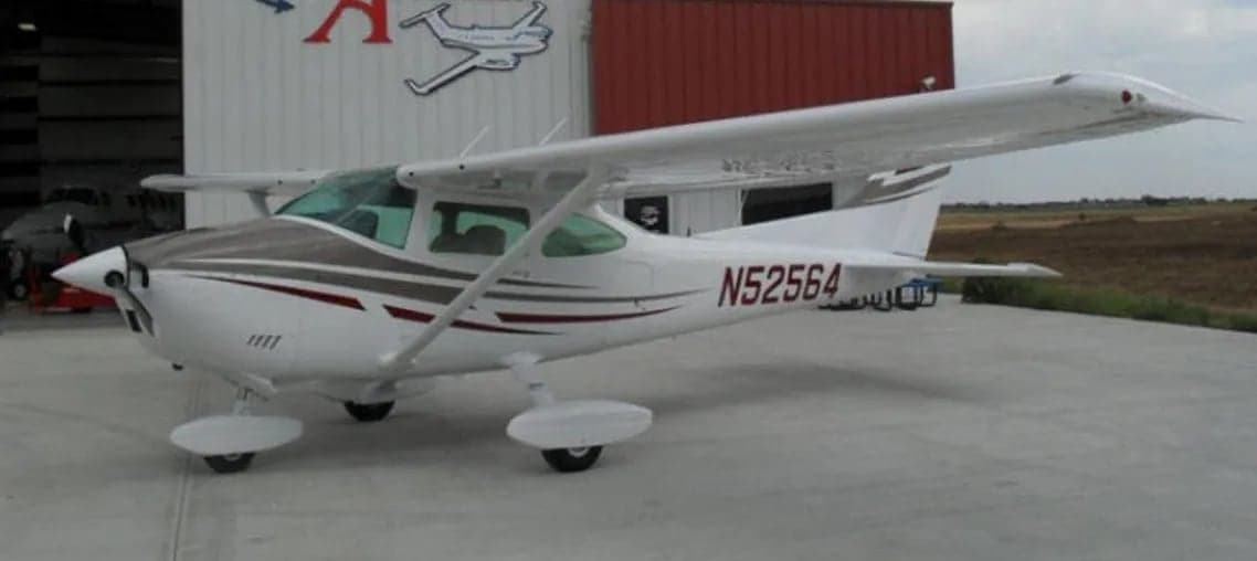 Cessna 182 Skylane N52564 parked outside a hangar.