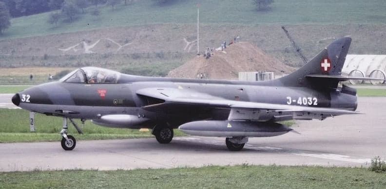 Hawker Hunter J-4032 landing on a runway.