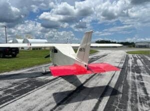 The tail of the white aircraft with registration number N9678 is visible on the tarmac.