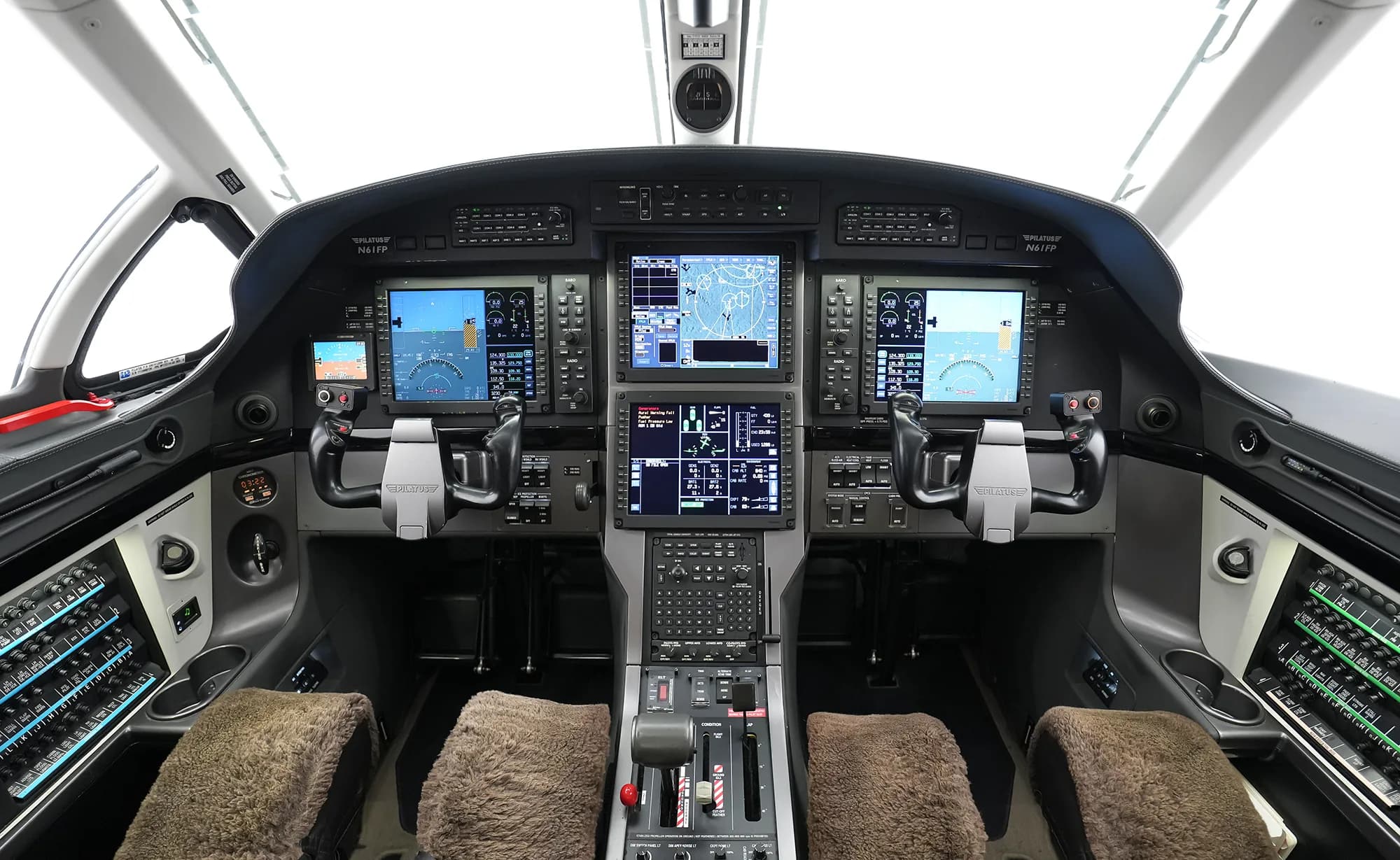 The aircraft cockpit features a modern glass panel with multiple digital displays and dual yokes.