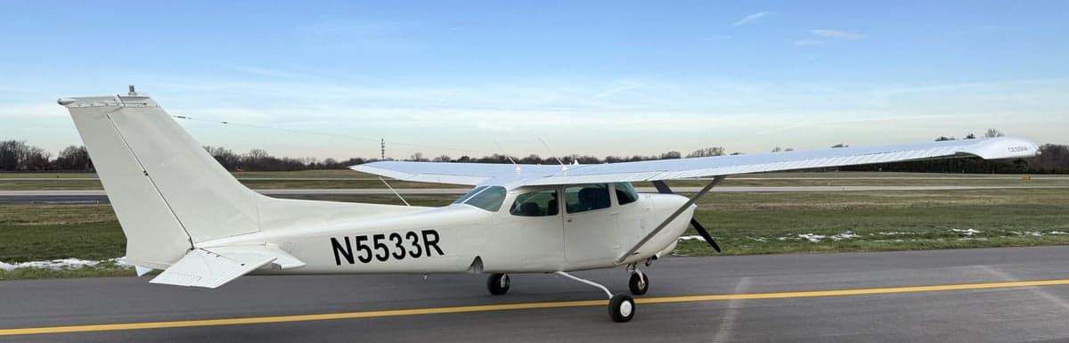 A Cessna 172 aircraft with tail number N5533R parked on the tarmac.