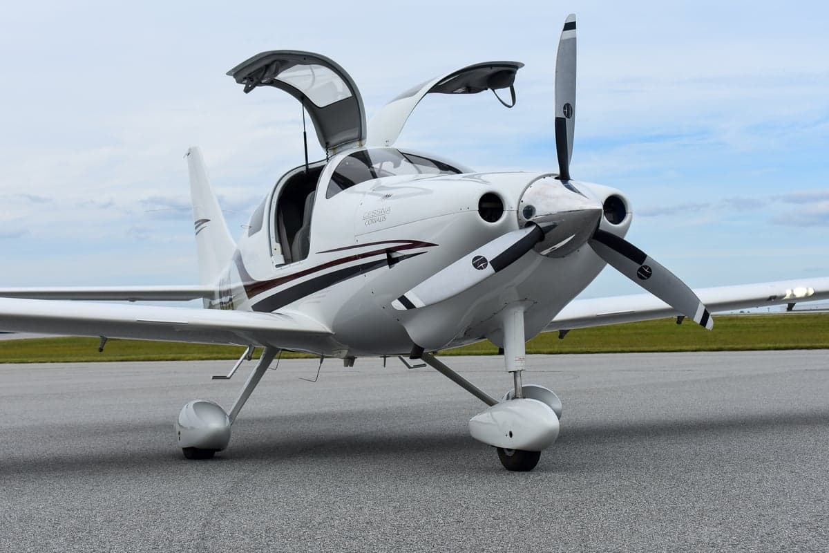 Front view of a white Cessna Corvalis on the tarmac.