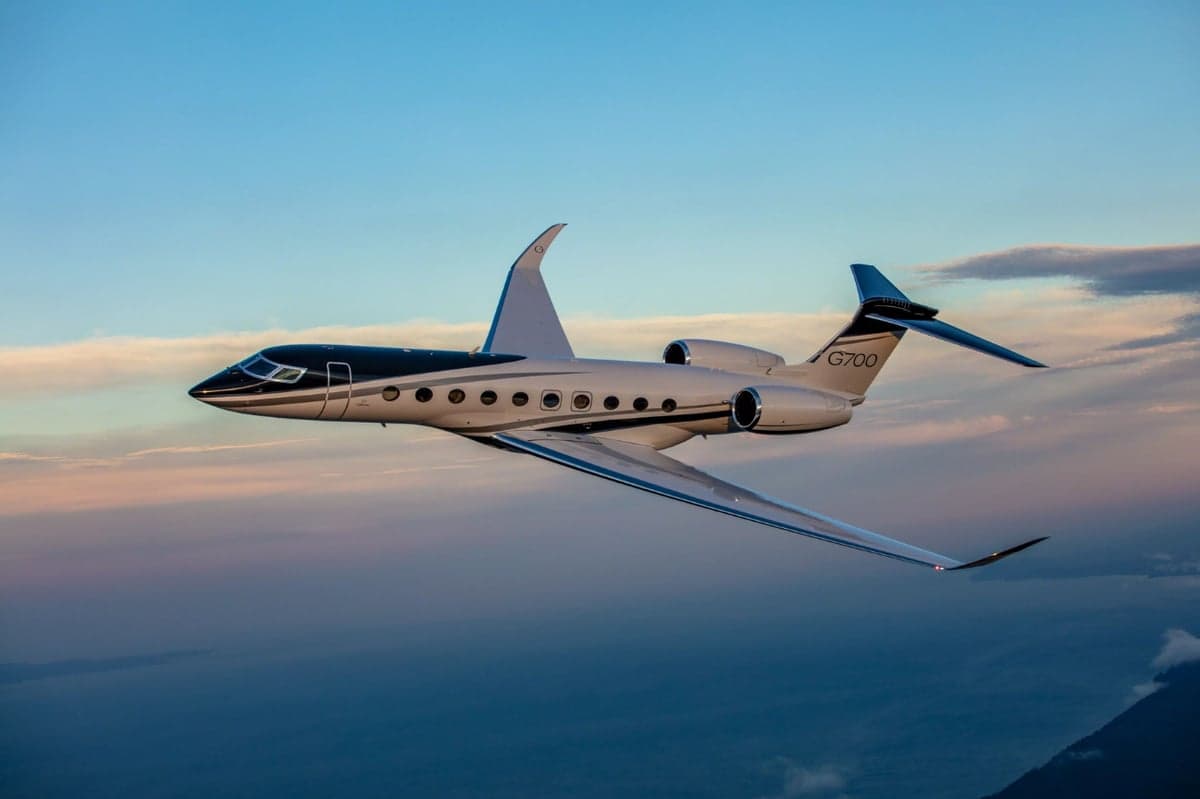 A Gulfstream G700 flying in the sky.