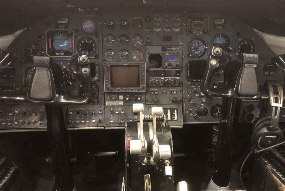 Detailed view of the aircraft's cockpit instrument panel and controls.