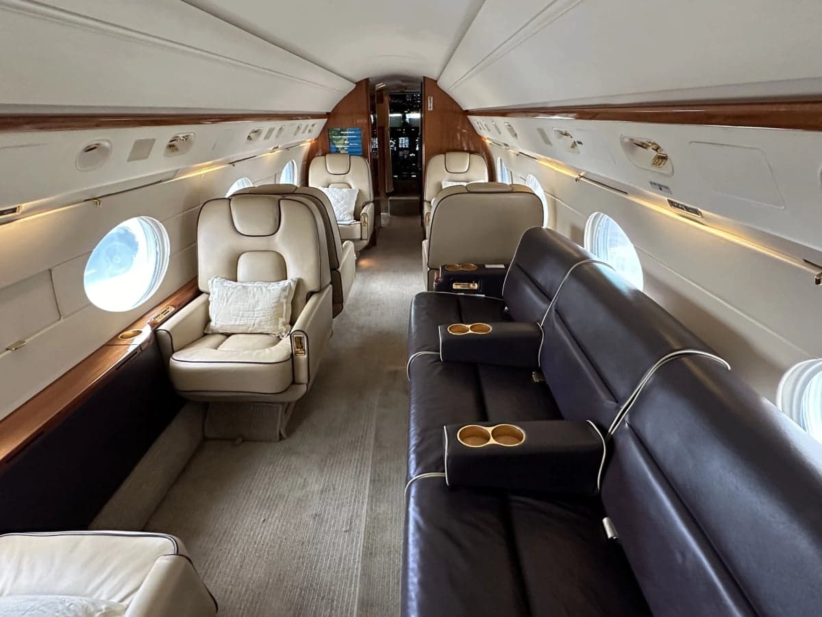 A view of the aircraft interior showing the leather seats and cabin.