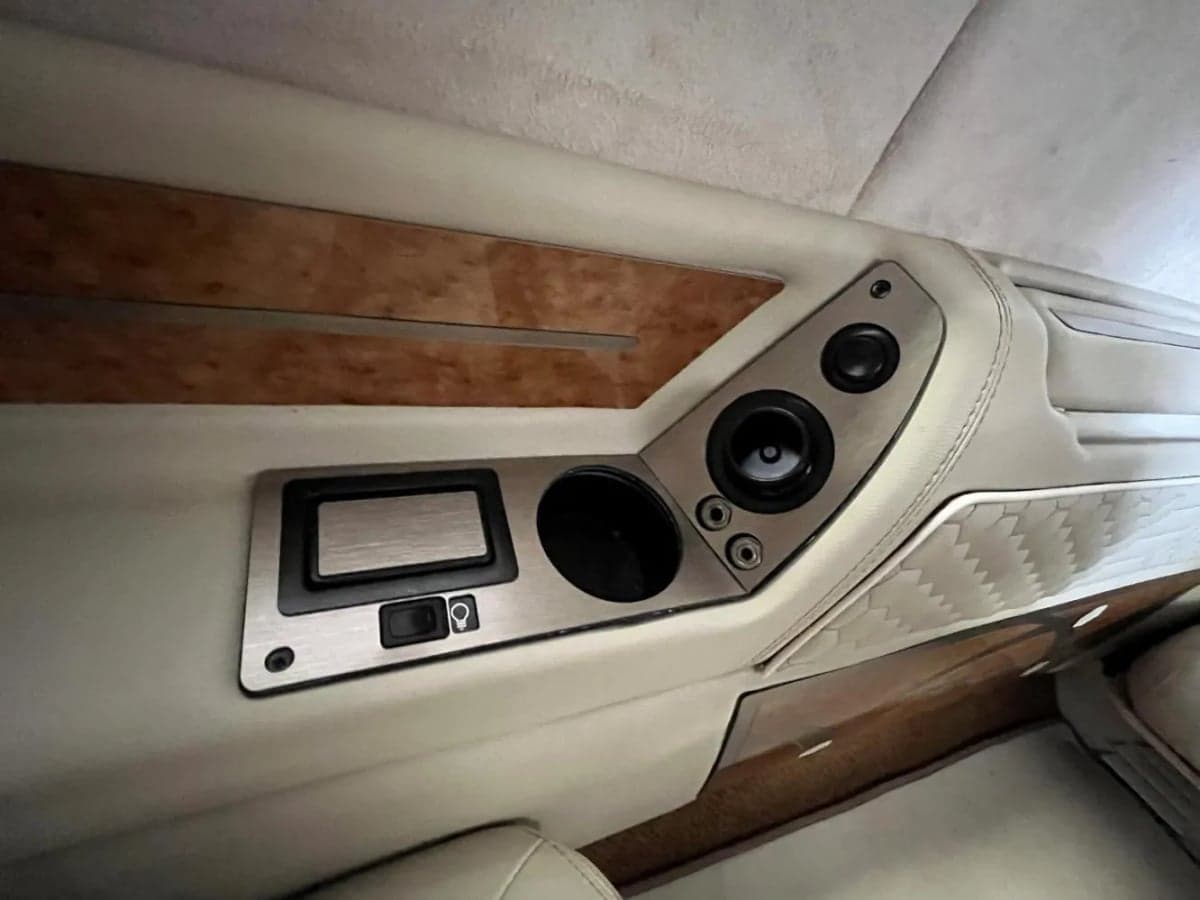 Interior detail of the aircraft's side panel with speakers and controls.