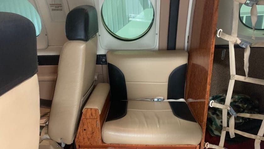 Close-up of a passenger seat in the aircraft's interior.
