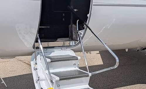 Close up of the stairs of a Hawker jet.
