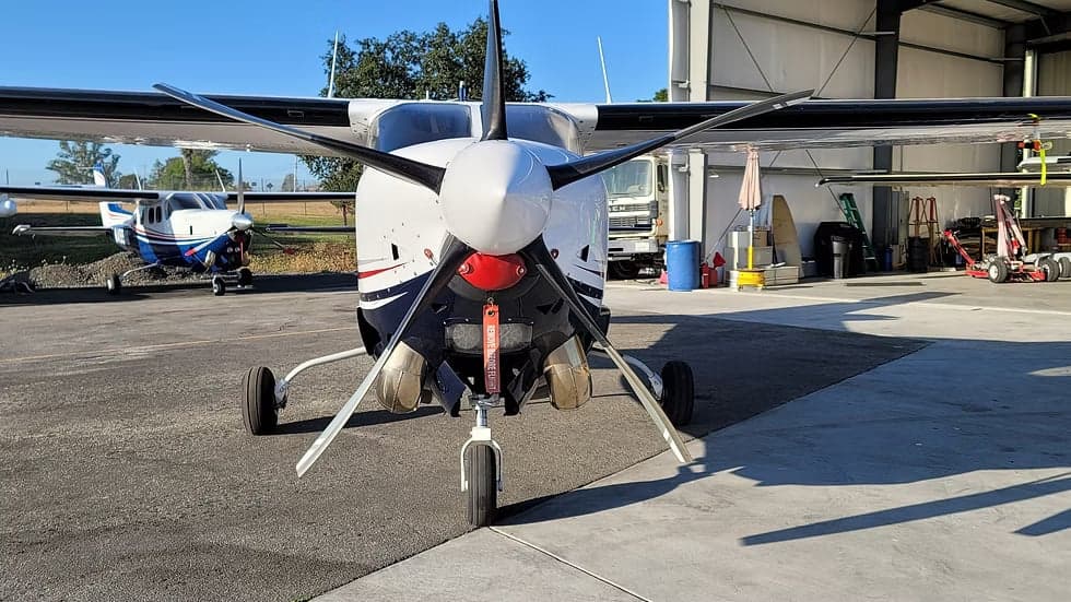 Front view of the N43CP aircraft, showing the propeller and landing gear.