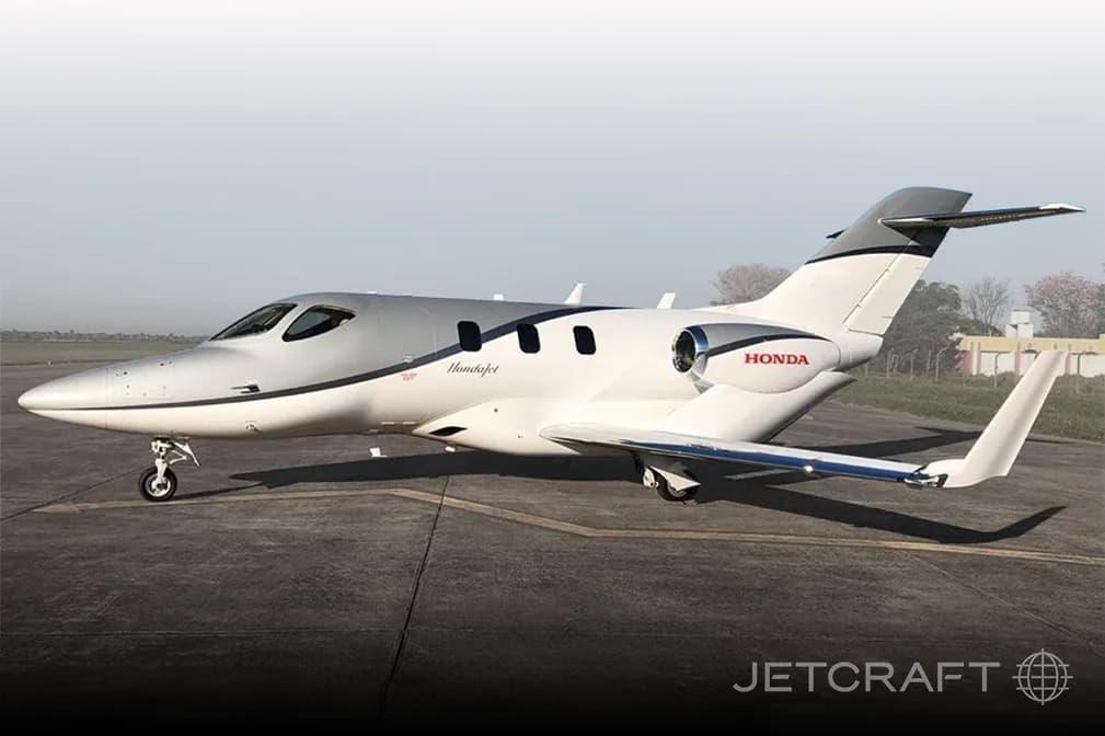 Stock photo of a HondaJet on the tarmac.