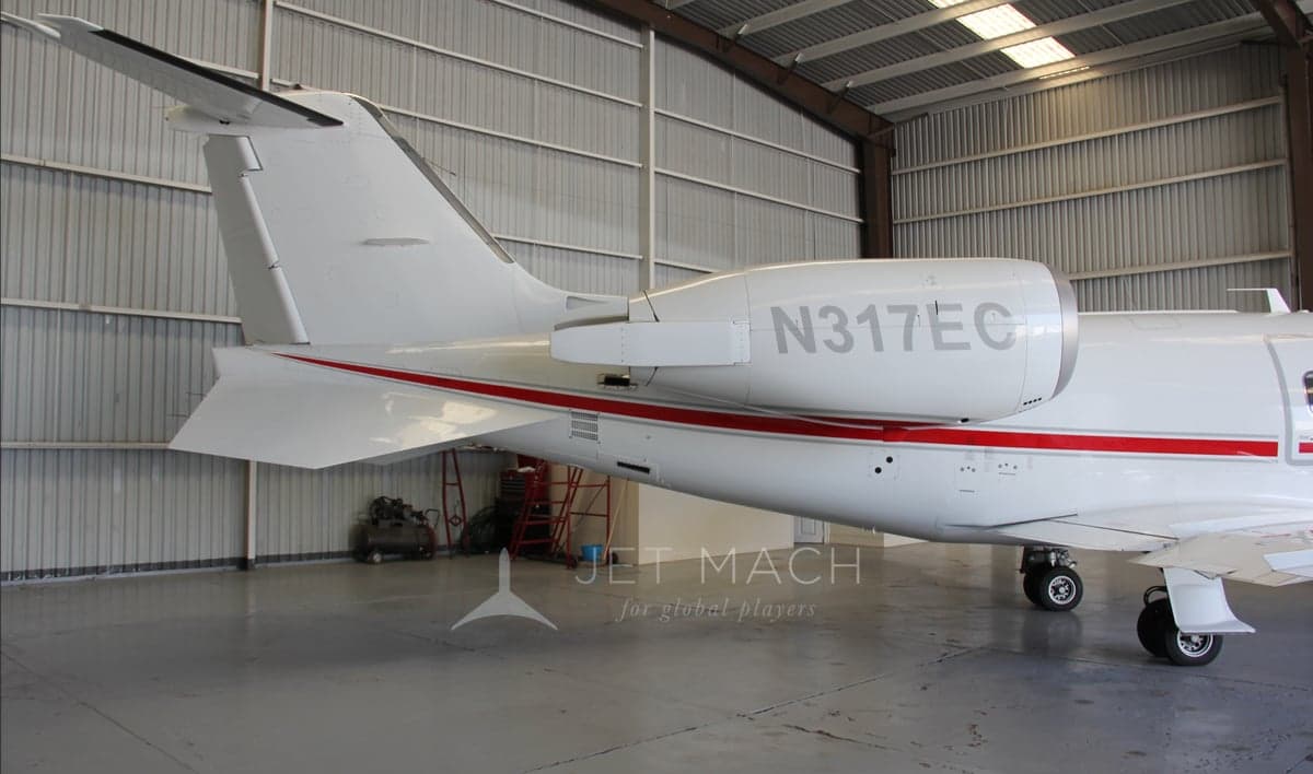 Close-up of the tail section of the N317EC aircraft, displaying the registration number.