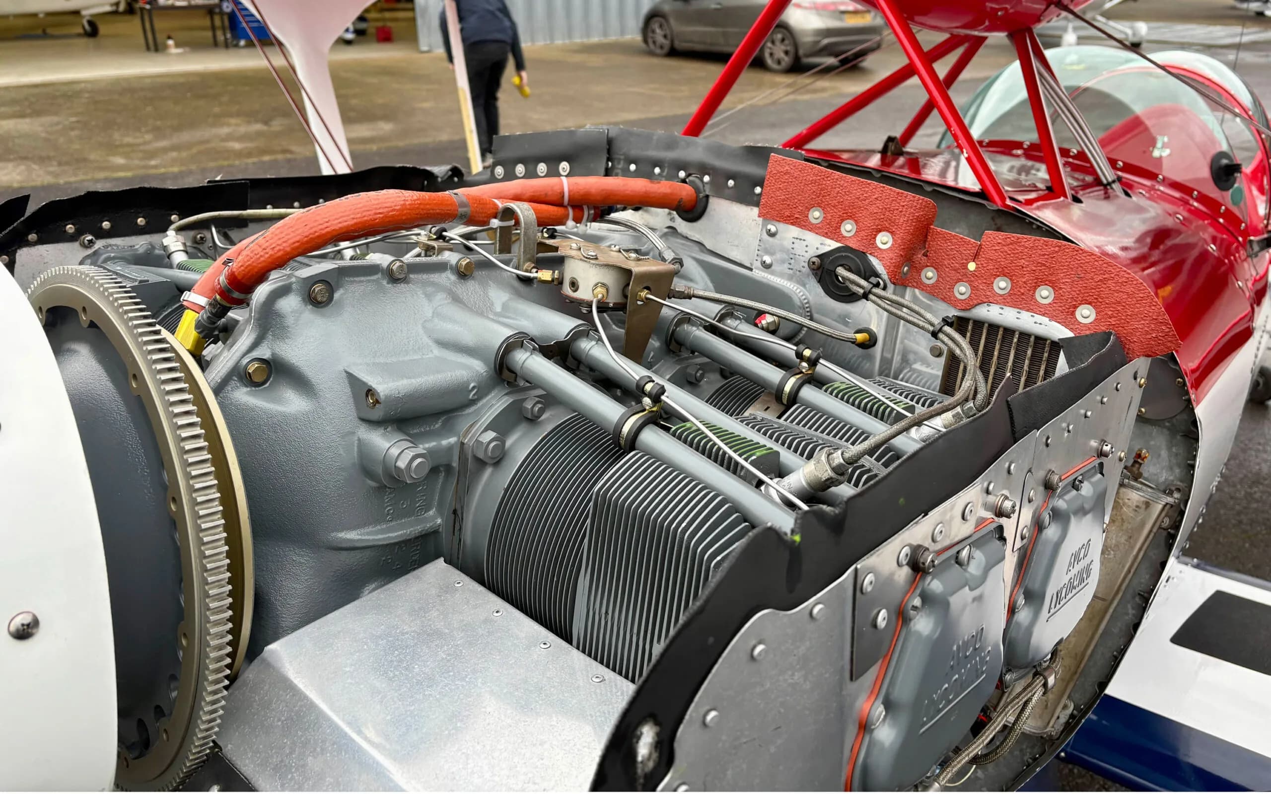 A detailed view of the exposed engine block and propeller hub of the Pitts S1T biplane.
