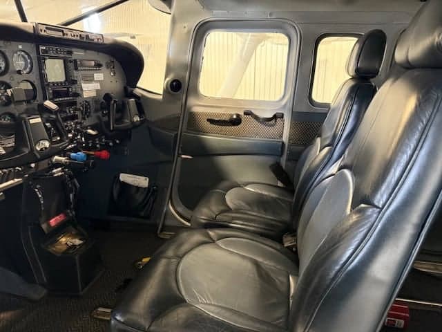 View of the aircraft's cockpit and cabin seats.