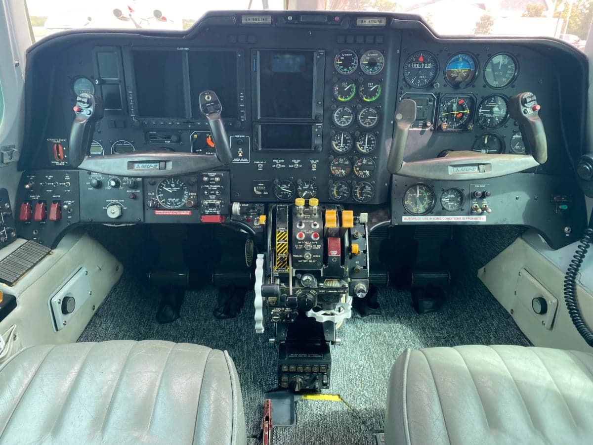 The cockpit of the aircraft features a full instrument panel and control sticks.