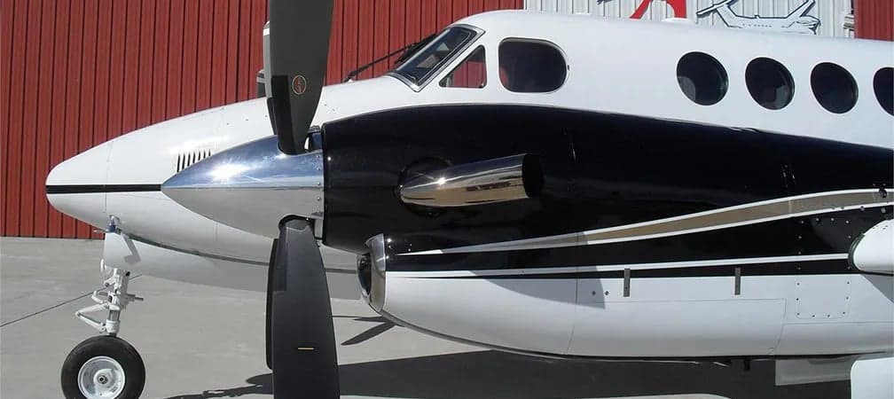 Close up of the nose and propeller of a King Air aircraft.
