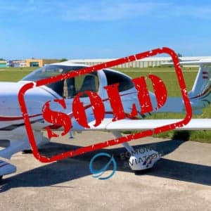 Diamond DA40 aircraft with red and white paint scheme on the tarmac, with a SOLD overlay.