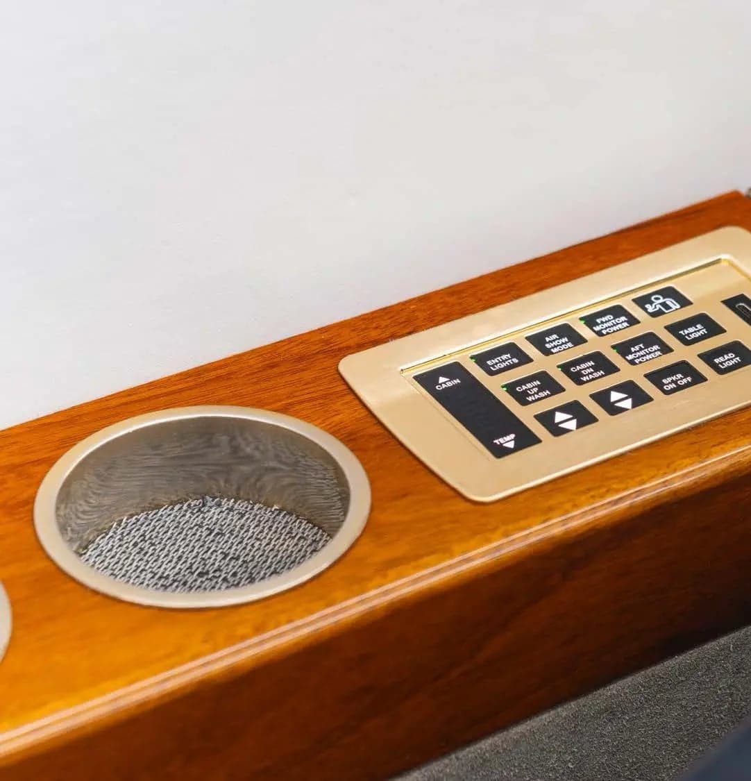 Close up of the cabin controls and cupholders.