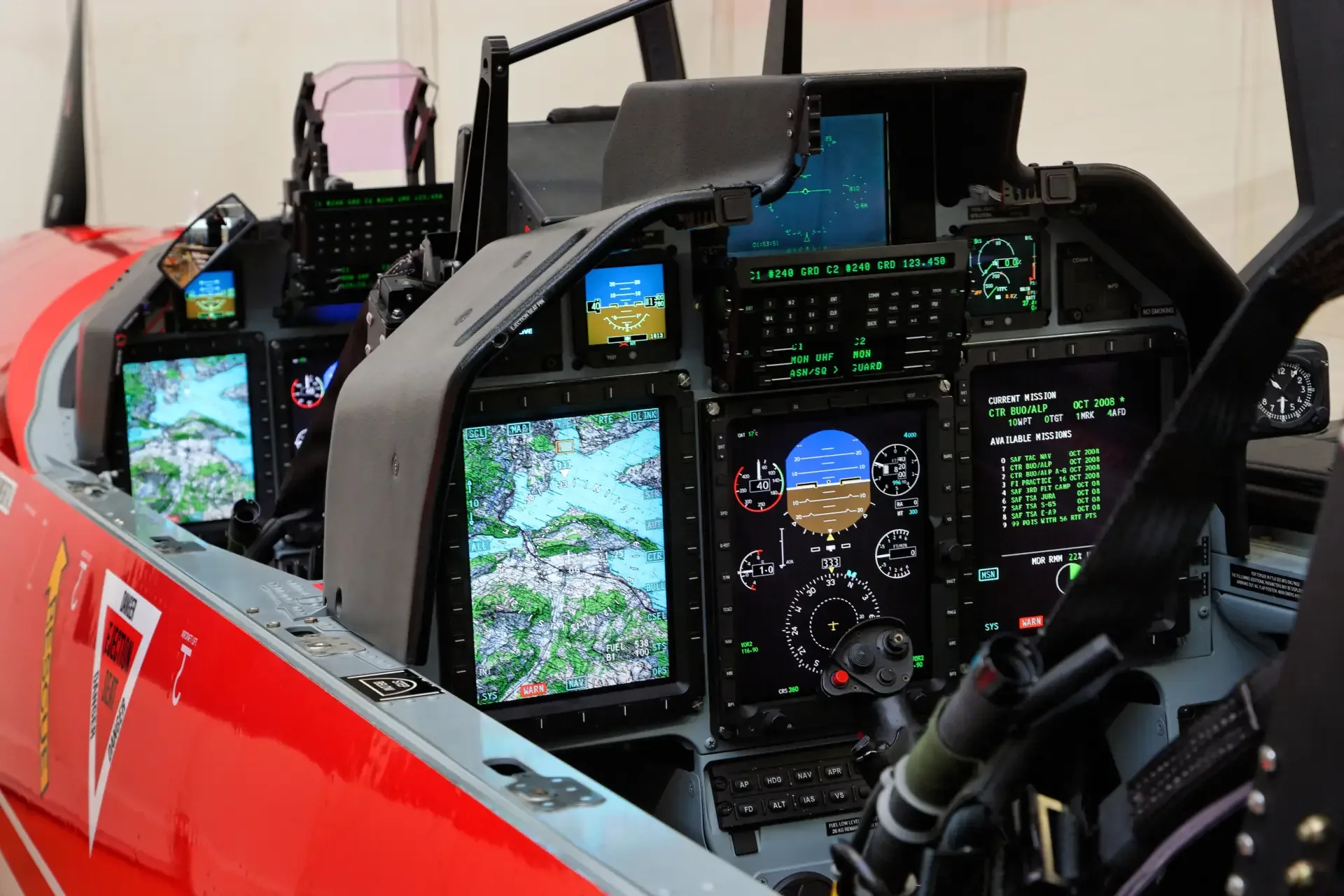 Close-up of the cockpit instrument panel of a Pilatus PC-21 aircraft.