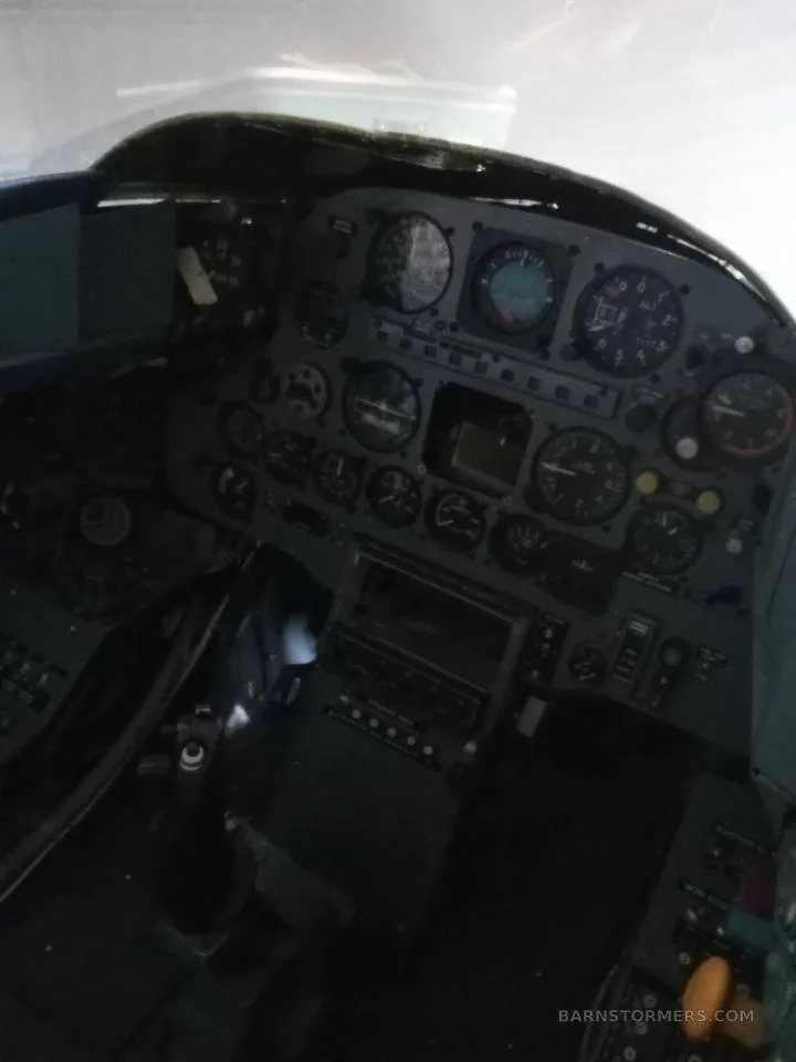 A close-up view of an aircraft's instrument panel with multiple gauges and controls.