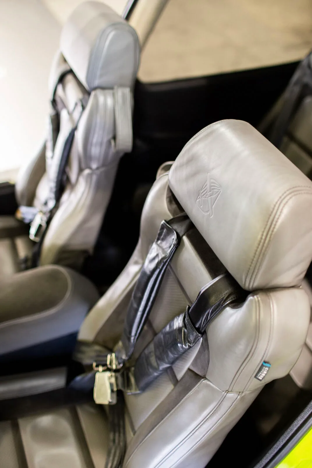 Close-up of the gray leather front seats in the Cirrus SR20 cabin.