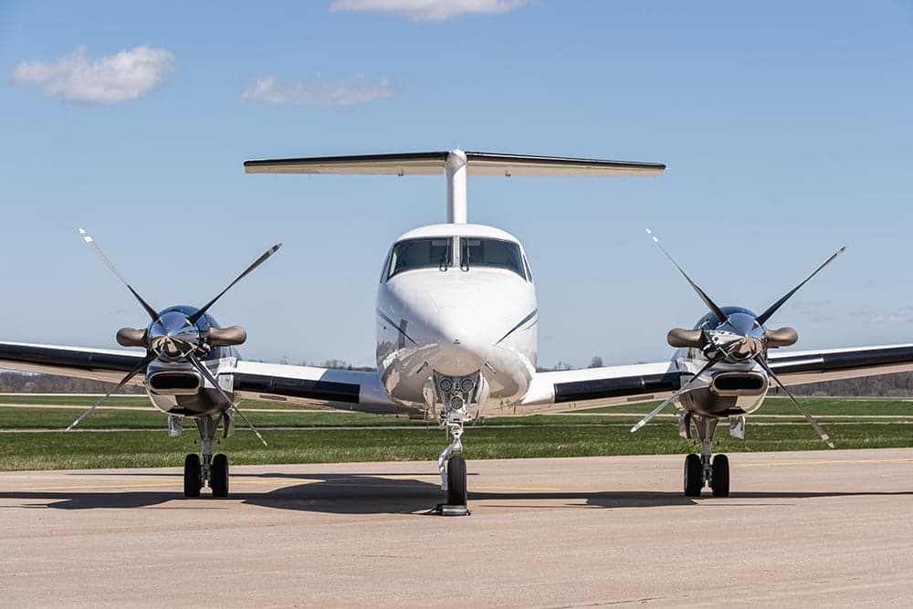 Front view of a Beechcraft King Air 350i aircraft on the ground.
