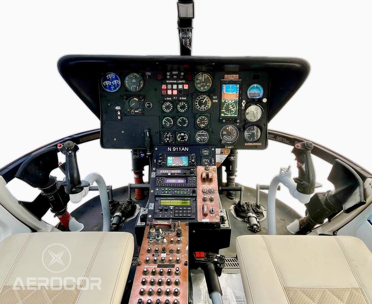 The full instrument panel and controls of a helicopter cockpit, showing registration N911AN.