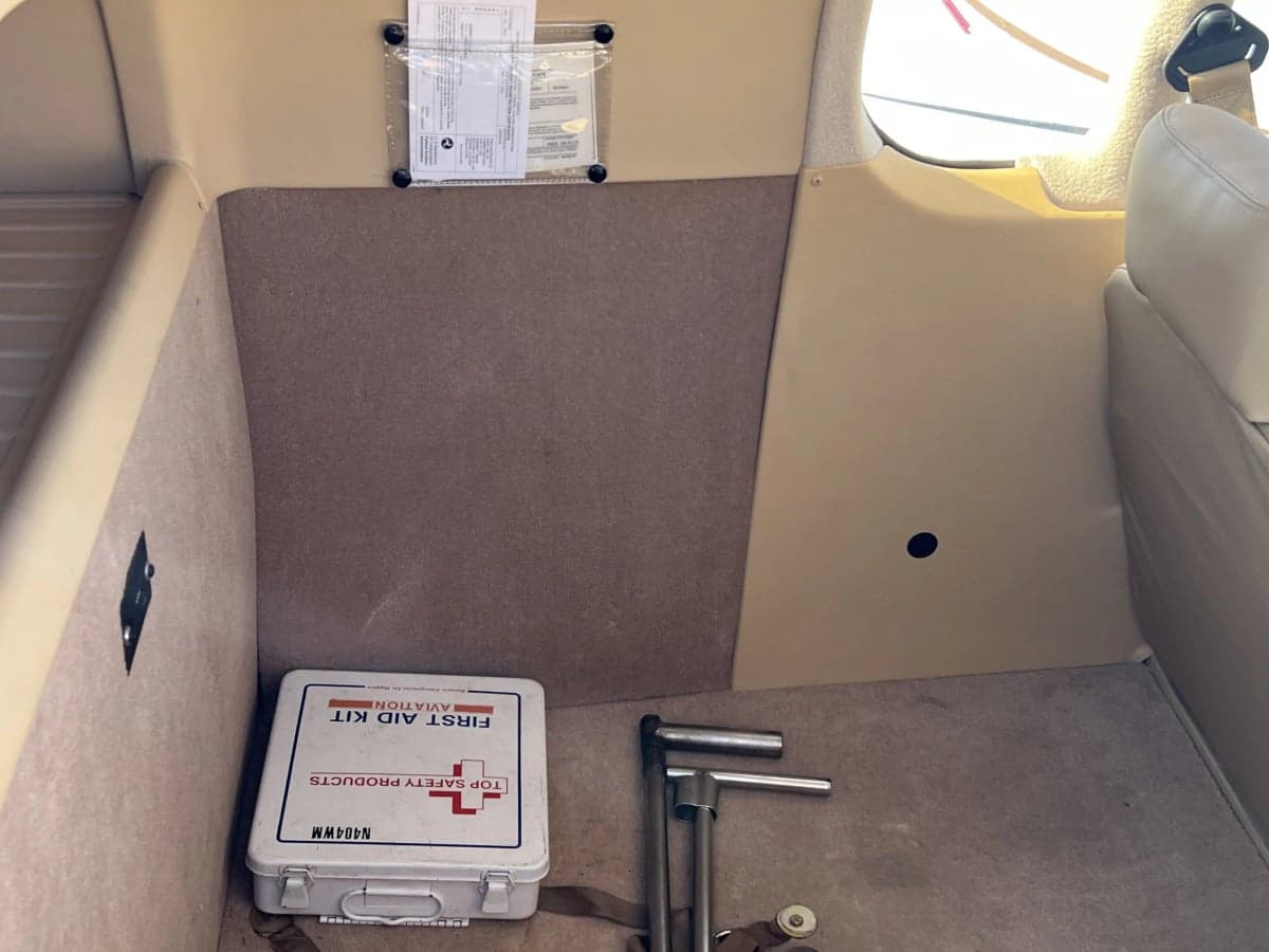 View of the rear interior with a first aid kit.