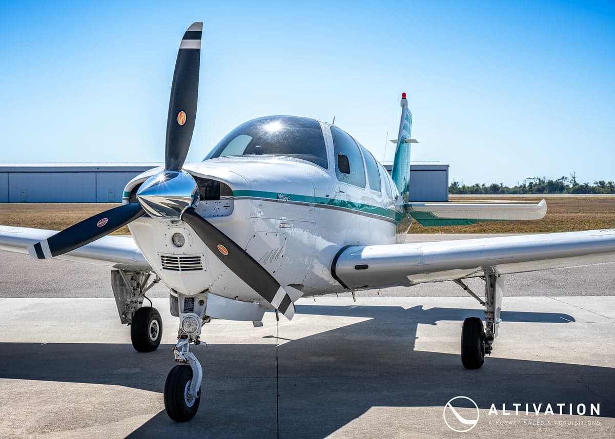 A Beechcraft Bonanza with registration N54DG parked on the tarmac.