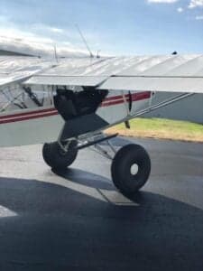 Close-up of the aircraft's landing gear and wing.