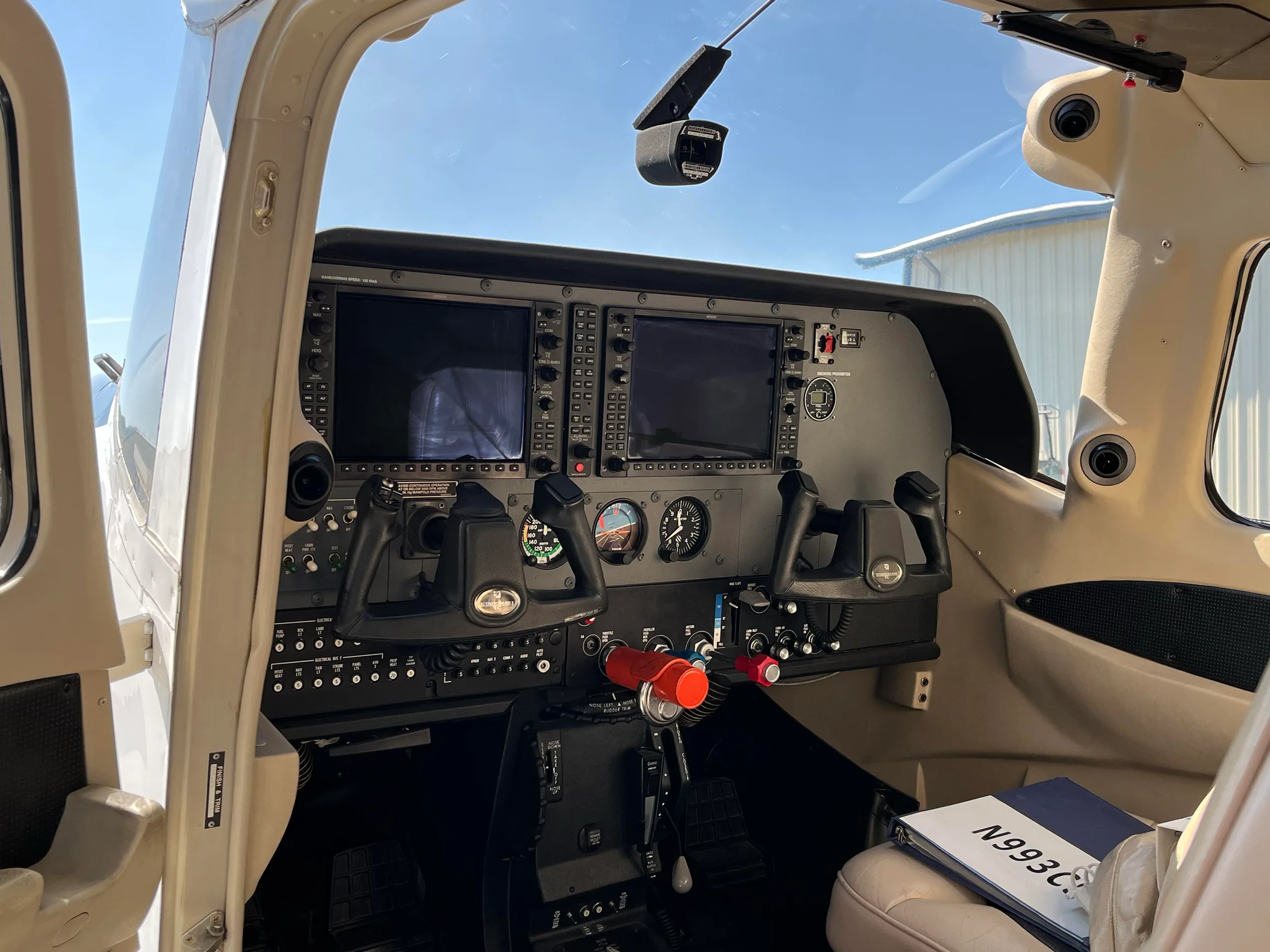 View of the cockpit featuring the instrument panel and control yokes.