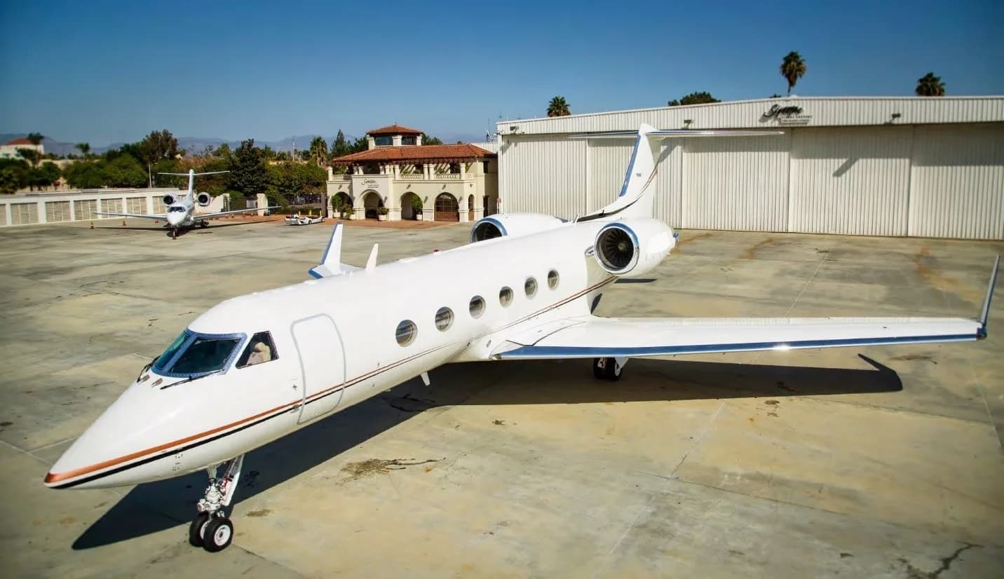 Gulfstream jet on the tarmac with a white paint scheme.