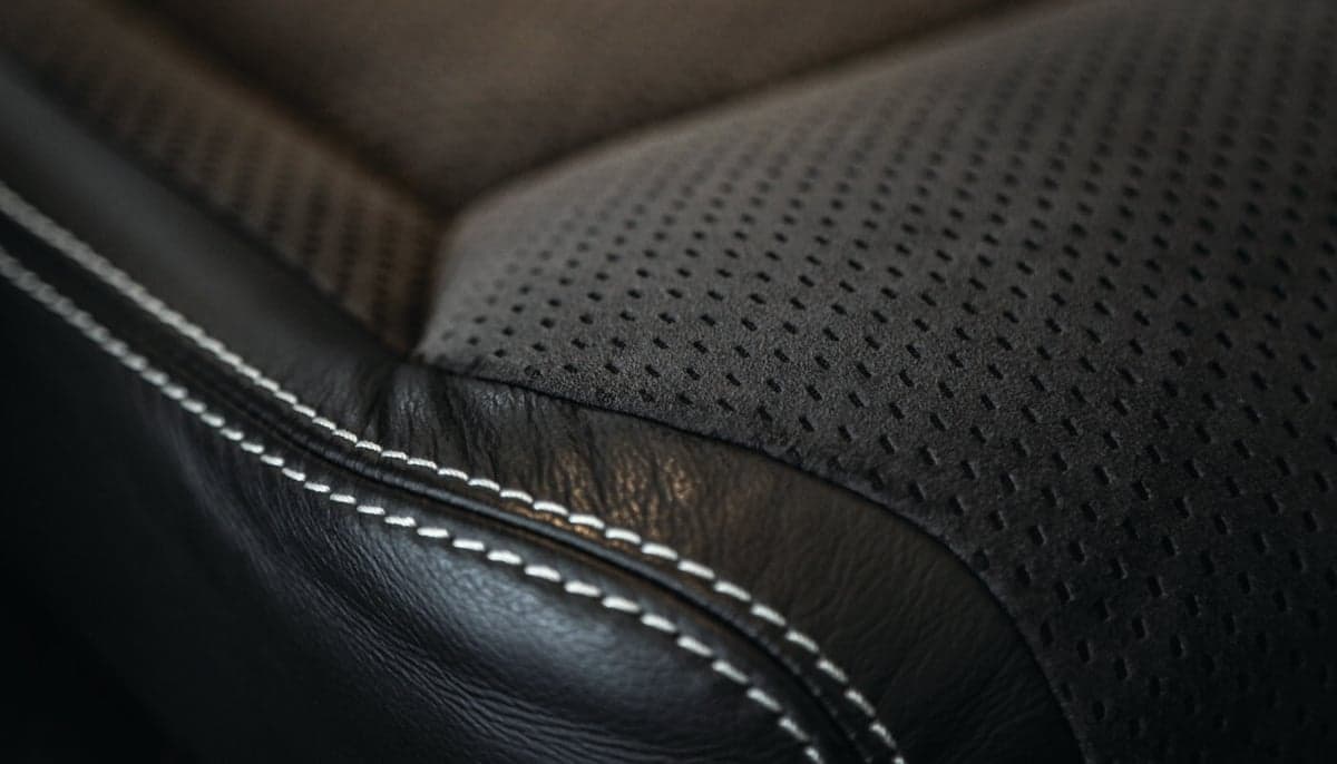 Close-up of the aircraft's leather seat with stitching.