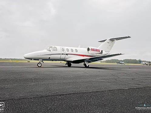 A Cessna Citation CJ1+ aircraft with registration N608MM parked on the tarmac.