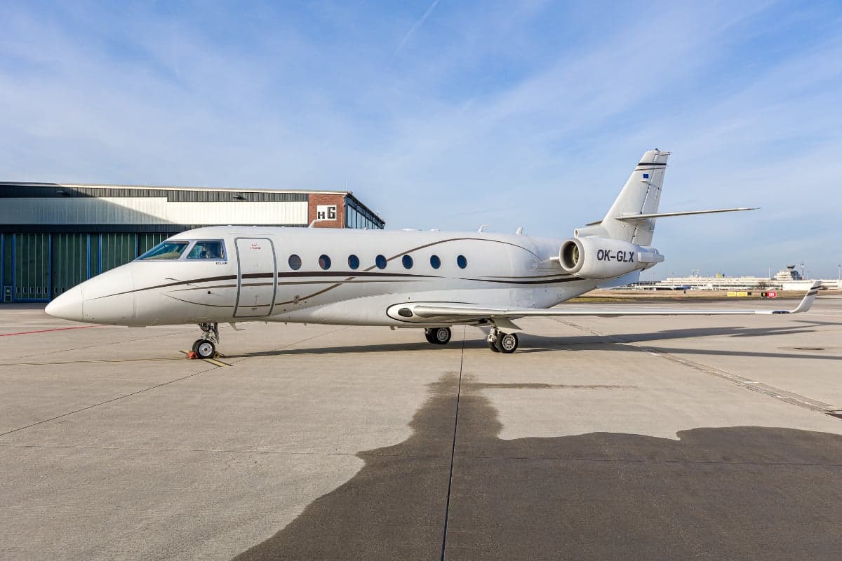 Gulfstream G200 aircraft with the tail number OK-GLX parked on the tarmac.