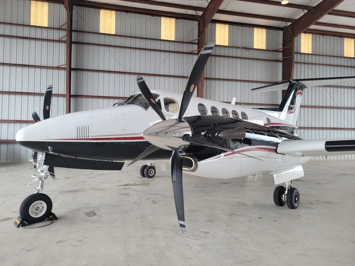 N494MA King Air in a hangar, side view.