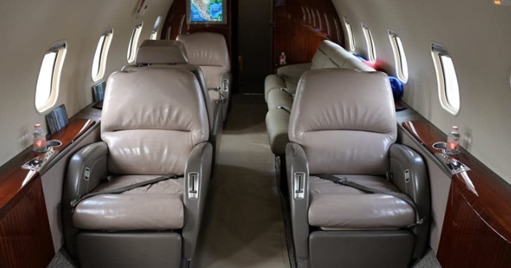 Interior view of the aircraft cabin with leather seats.
