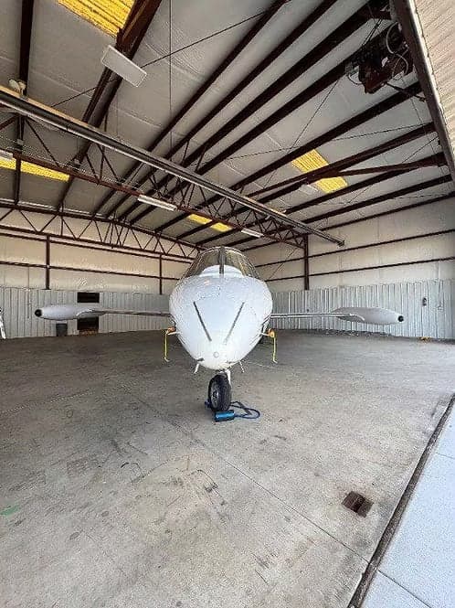 Front view of a Learjet 35A in a hangar.